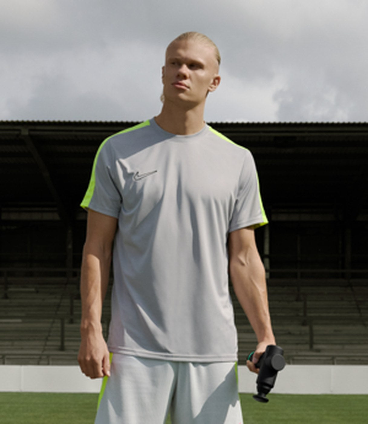 A footballer standing over a ball on the pitch
